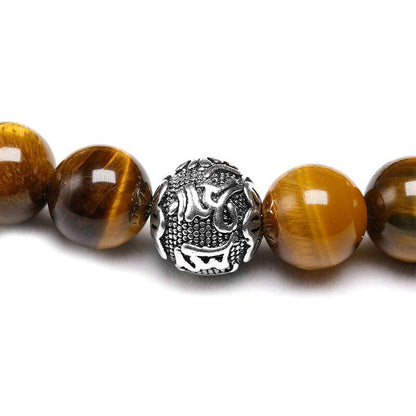 Natural tiger eye bracelet and 3 cylindrical beads engraved "Om Mani Padme Hum" | Bracelet | Bracelet, new, Om Mani Padme Hum, Tiger Eye, Tiger's Eye | Guided Meditation
