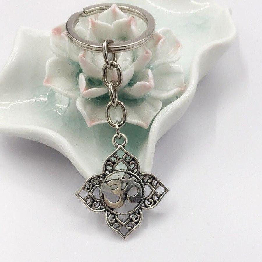 Lotus flower and "Om" symbol protective key ring | Porte clés | key ring, Lotus flower, Porte clés | Guided Meditation